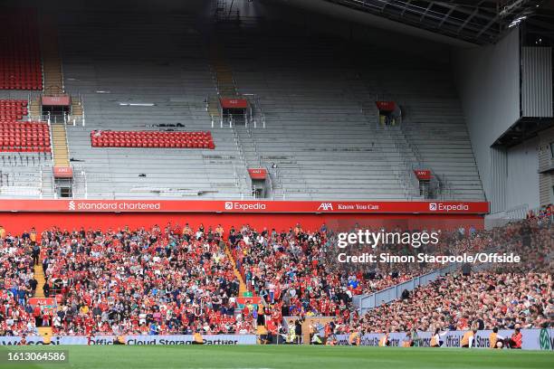 General view as fans sit beneath the incomplete building works in the new Anfield Road Stand during the Premier League match between Liverpool FC and...