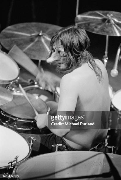 Drummer John Bonham wearing a mask during a performance with Led Zeppelin at Newcastle City Hall, 1st December 1972.