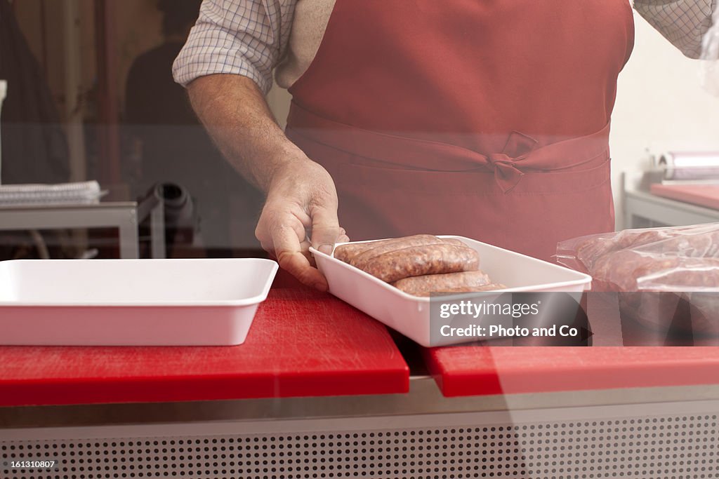 Butcher in his shop