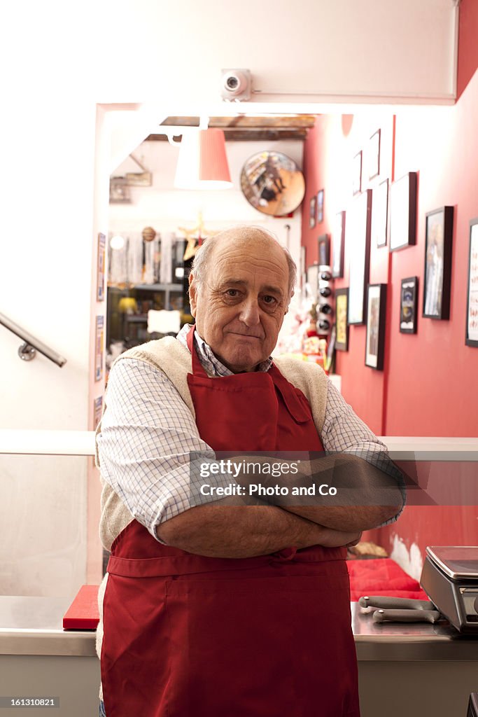 Portrait of butcher in his shop