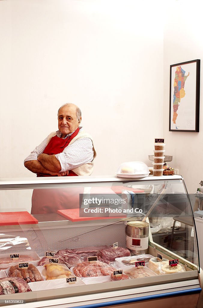 Portrait of butcher on his shop