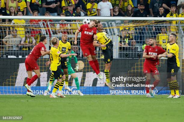 Luca Kilian of 1.FC Koeln and Mats Hummels of Borussia Dortmund battle for the Ball during the Bundesliga match between Borussia Dortmund and 1. FC...