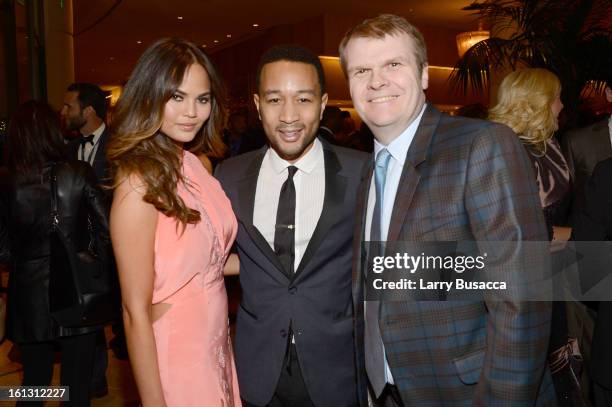 Model Christine Teigen, singer John Legend and Columbia Chairman/CEO Rob Stringer arrive at the 55th Annual GRAMMY Awards Pre-GRAMMY Gala and Salute...