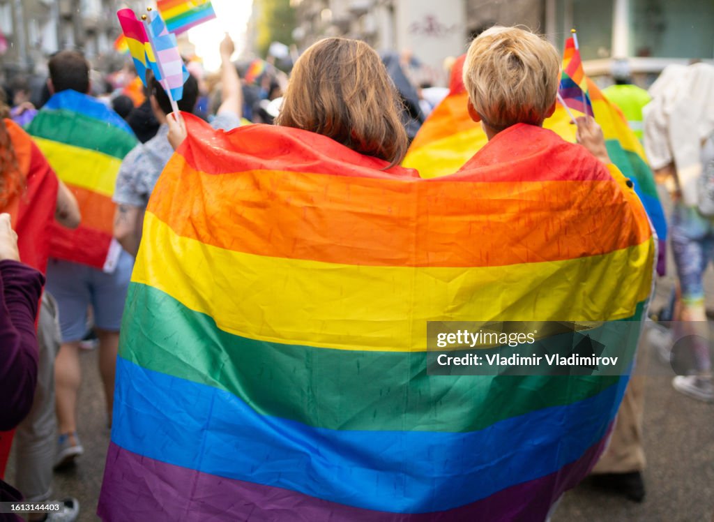 LGBT women wearing flags during pride event