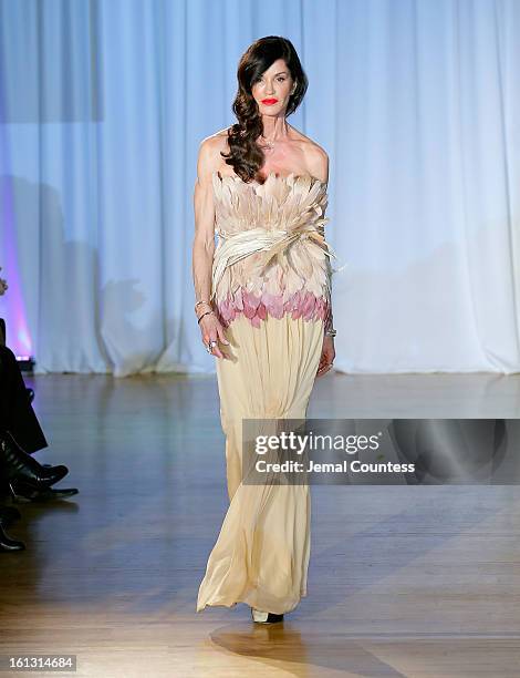 Model Janice Dickinson walks the runway at the Reality of FASHION the Reality of AIDS fall 2013 fashion show during Mercedes-Benz Fashion Week at the...