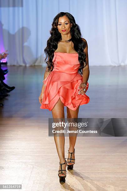 Reality TV actress Karlie Redd walks the runway at the Reality of FASHION the Reality of AIDS fall 2013 fashion show during Mercedes-Benz Fashion...