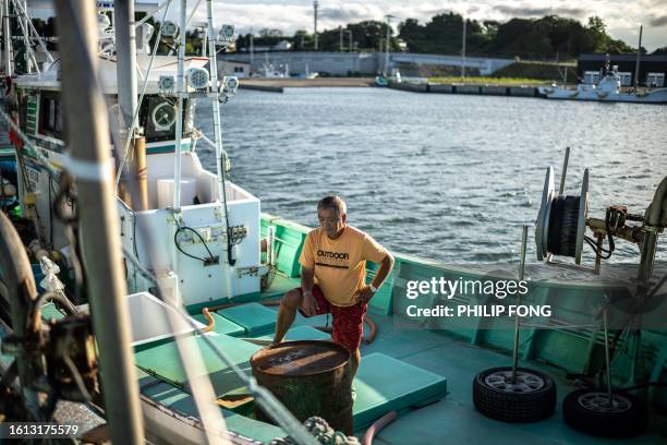 Fisherman Haruo Ono stands on one of his fishing boats at Tsurushihama Fishing Port, Shinchi-machi of Fukushima Prefecture, some 60 kms north of the...