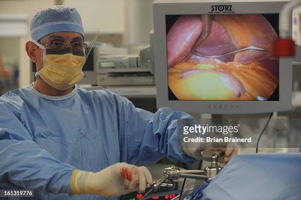 CdXXobese_bb_2 -- Dr. Matthew Metz performs a Laparoscopic Gastric Band surgery at Presbyterian/St. Luke's Hospital. He has been seeing patients who...