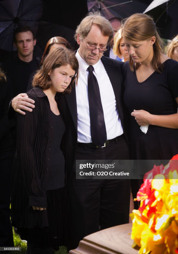 Grieving Father And Daughters High-Res Stock Photo - Getty Images