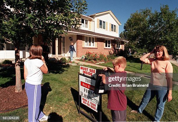 Margie Jost with children Allison Stephanie Daniel, 8. They are selling the house at 6615 E Heritage Place in the Cherry Creek school district to...