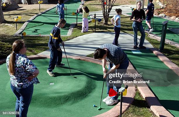 Evergreen, Colo., March 31, 2002 -- Families pack the Hyland Hills Adventure Golf Sunday afternoon in Westminster. The warm, sunny weather made it a...