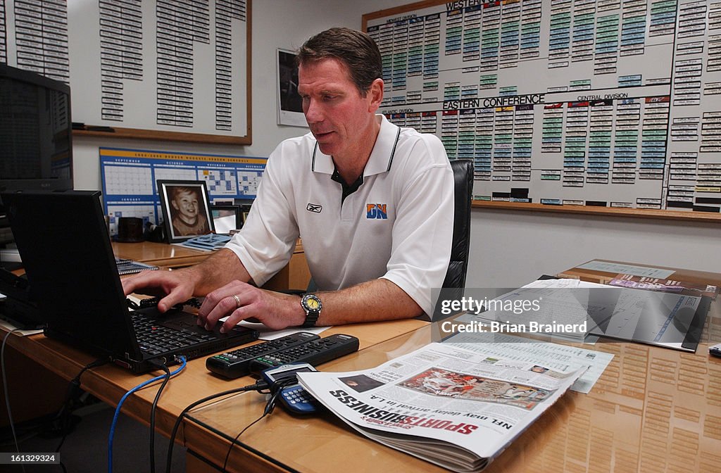 DENVER, CO, OCT 27, 2004 --<cq>Denver Nuggets General Manager Kiki Vandeweghe in his office at the Pepsi Center. One half looks like a command center with all team rosters and available players on magnetic boards surrounding his computer work center, the 