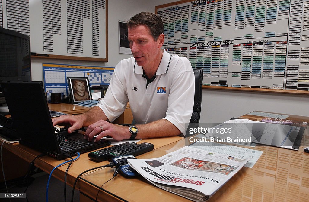DENVER, CO, OCT 27, 2004 --<cq>Denver Nuggets General Manager Kiki Vandeweghe in his office at the Pepsi Center. One half looks like a command center with all team rosters and available players on magnetic boards surrounding his computer work center, the
