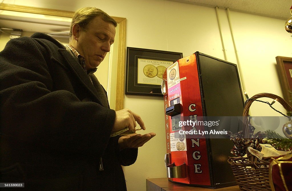 DENVER,COLORADO, DEC. 7, 2004-The Sacagawea Dollar , 2001D (only this coin) , can be purchased from a change machine at the Denver Mint's visitors center at East Colfax Ave. and Cherokee Street ( 320 West Colfax Ave.). Joe Yocum <cq> , from Lexington, Ken