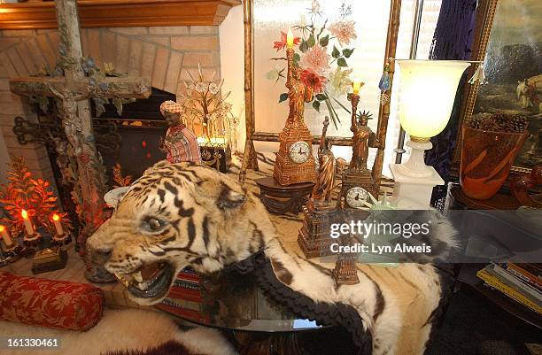 "At Home" with Judy White the living room corner with Statue of Libery collection on an animal skin rug