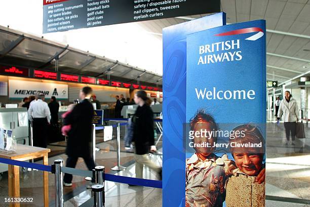 British Airways sign welcomes international travelers near the BA ticket counter at Denver International Airport Tuesday afternoon, 1/28/03.