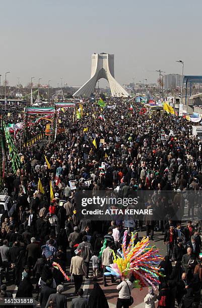 Iranians attend a rally in Tehran's Azadi Square to mark the 34th anniversary of the Islamic revolution on February 10, 2013. Hundreds of thousands...