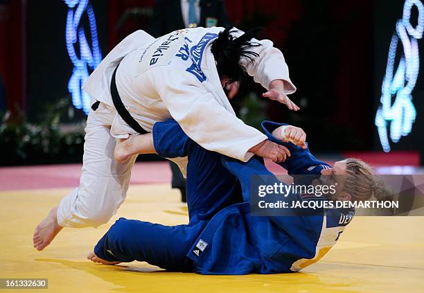 Korea's Kim Eun-Gyeong fights against France's Marjorie Deroose on February 10, 2013 in Paris, during the eliminatories of the Women + 78kg of the...