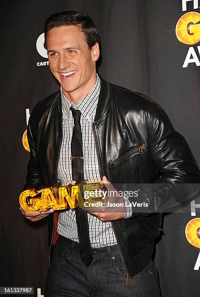 Olympic swimmer Ryan Lochte poses in the press room at Cartoon Network's 3rd annual Hall Of Game Awards at Barker Hangar on February 9, 2013 in Santa...