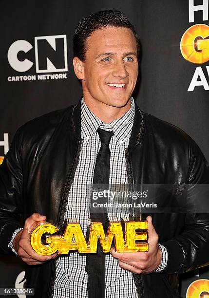 Olympic swimmer Ryan Lochte poses in the press room at Cartoon Network's 3rd annual Hall Of Game Awards at Barker Hangar on February 9, 2013 in Santa...