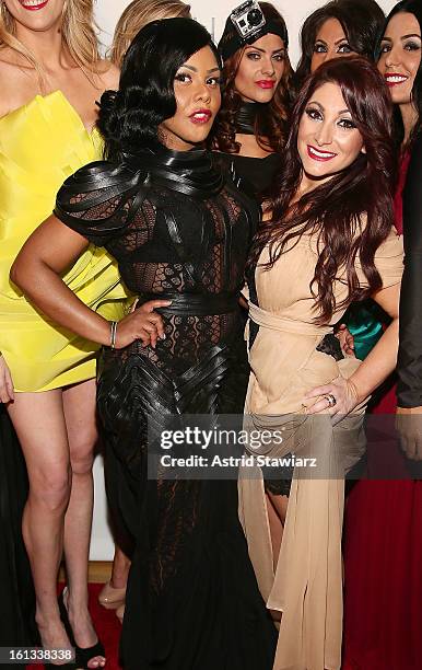 Rapper Lil' Kim and Deena Cortese pose for photos backstage at the Reality of FASHION the Reality of AIDS fall 2013 fashion show during Mercedes-Benz...