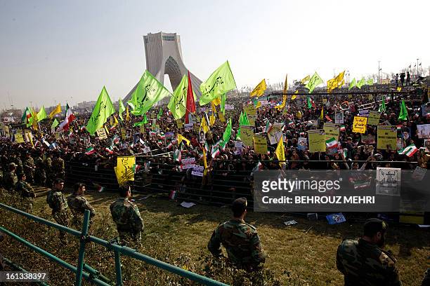 Iranians attend a rally in Tehran's Azadi Square to mark the 34th anniversary of the Islamic revolution on February 10, 2013. Hundreds of thousands...