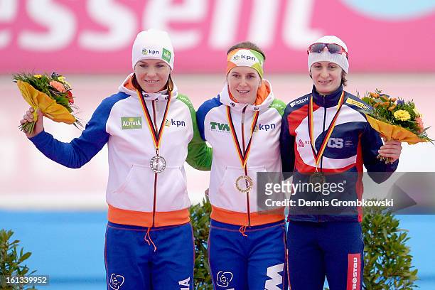 Diane Valkenburg of Netherlands, Ireen Wuest of Netherlands and Martina Sablikova of Czech Republic pose at the podium after the Women's 3000m...