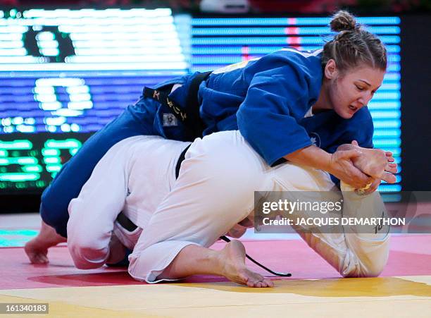 Canada's Kelita Zupancic fights against France's Marie Pasquet on February 10, 2013 in the women's 70kg category semi-finals during the Paris...