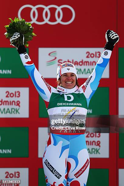 Marion Rolland of France celebrates at the flower ceremony after winning the Women's Downhill during the Alpine FIS Ski World Championships on...