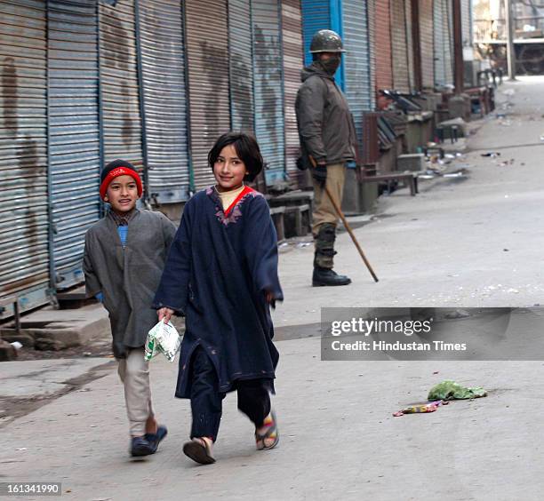 Kashmiri childrens are walking on deserted street after the parliament attack convict, Muhammad Afzal Guru was hanged in New Delhi, during Second day...