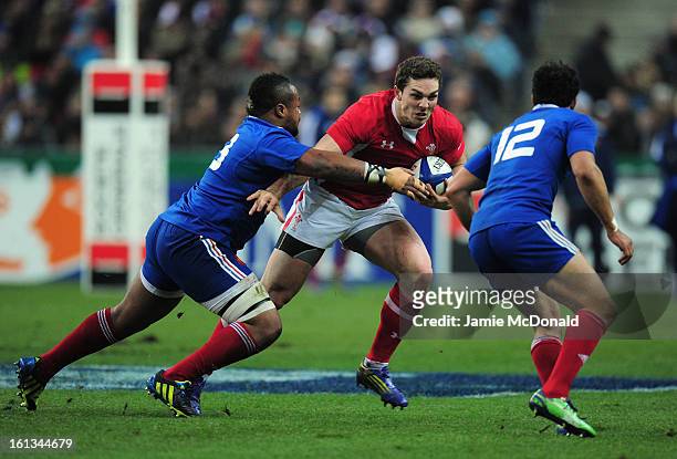 George North of Wales is tackled by Mathieu Bastareaud of France during the RBS Six Nations match between France and Wales at Stade de France on...