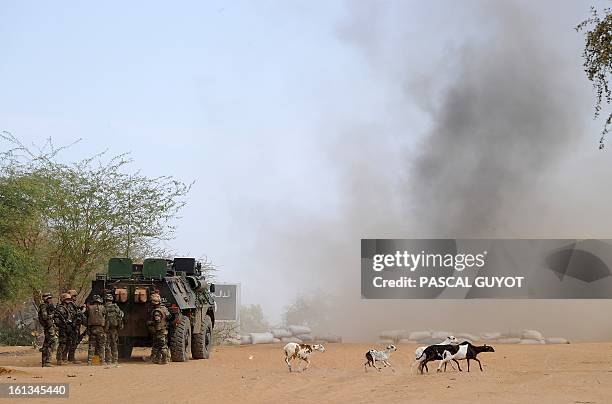 French soldiers explode three land mines at the site where a suicide bomber blew himself up on February 10, 2013 in northern Gao on the road to...