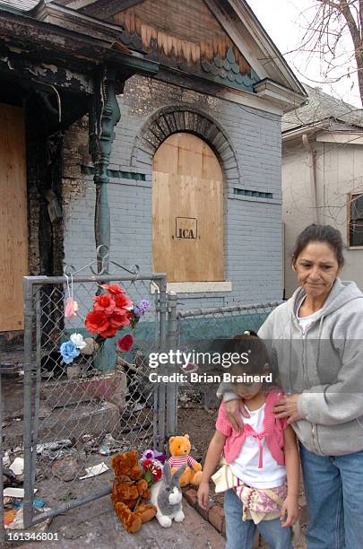 March 16, 2006--<cq>Scene of a fire at 3777 Franklin Street in the Cole neighborhood Thursday afternoon. Neighbors and mourners have left flowers and...