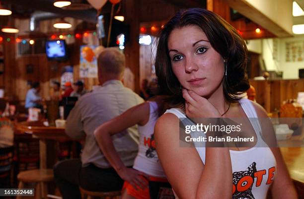 Waitress <cq> Tiffany <cq> at the LoDo Hooters, 1920 Blake Street, waits for an order while working the Broncos game crowd Sunday afternoon. Denver...