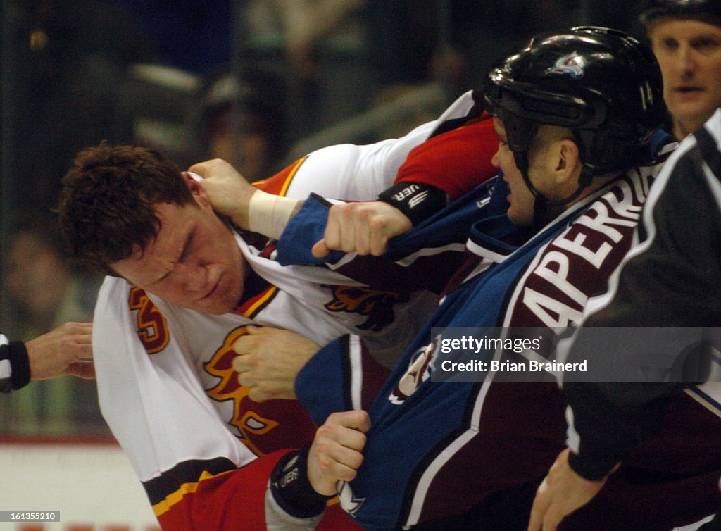 (BB) avalanche08 -- DENVER, CO. 04/08/2007 -- Av. Ian Laperriere gets the better of Flames' Dion Phaneuf in the third period Sunday night at Pepsi Center to close out the season with a 6-3 win. (Denver Post Staff Photo Brian Brainerd)