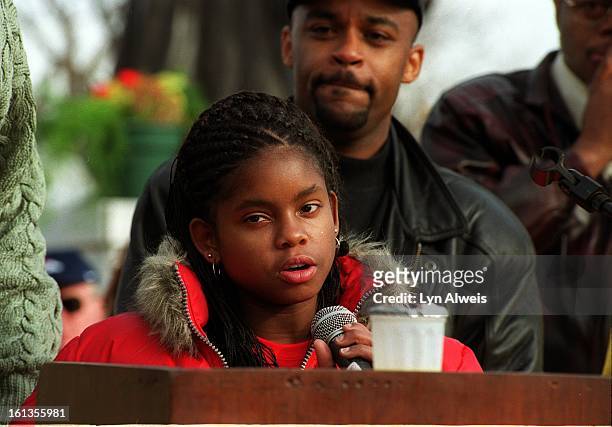 The 2000 Martin Luther King Jr. Marade, Denver Hydeia Broadbent, who was born HIV positive, spoke to the crowd in City Park. Behind her is Michael...