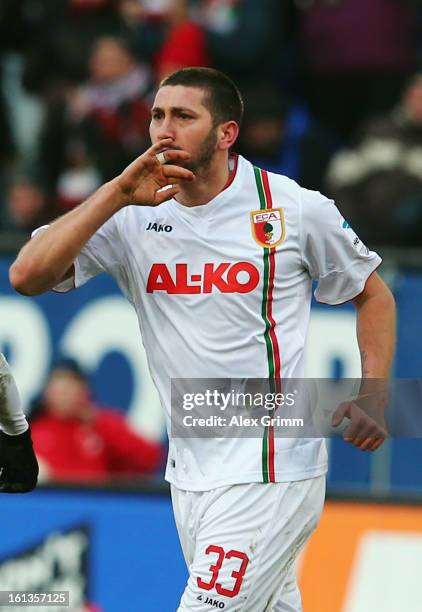 Sascha Moelders of Augsburg celebrates his team's first goal during the Bundesliga match between FC Augsburg and 1. FSV Mainz 05 at SGL Arena on...