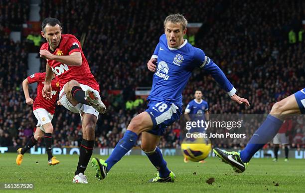 Ryan Giggs of Manchester United scores their first goal during the Barclays Premier League match between Manchester United and Everton at Old...