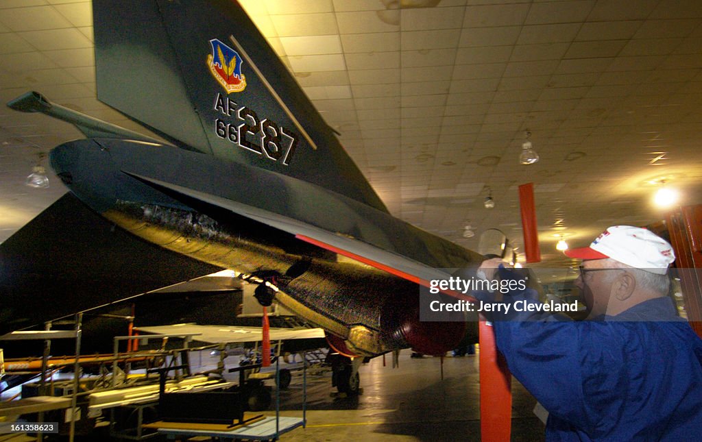 DENVER, COLO. - NOVEMBER 25, 2005 - Rodger Blum<cq> of Aurora makes a weekly inspection of an F-4E Phantom II<cq> fighter in the Wings Over The Rockies Air and Space Museum<cq> at the former Lowry Air Force Base in Denver. Blum, a veteran of decades of mi