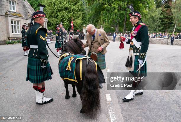 King Charles III meets the Royal Regiment of Scotland mascot Shetland pony, Corporal Cruachan IV, during the inspection of Balaklava Company, 5th...