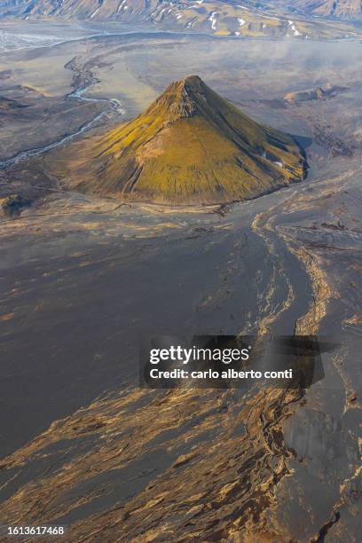 aerial view shooted by airplane of maelifell mountain during a summer sunny day, iceland, europe - maelifell stock pictures, royalty-free photos & images