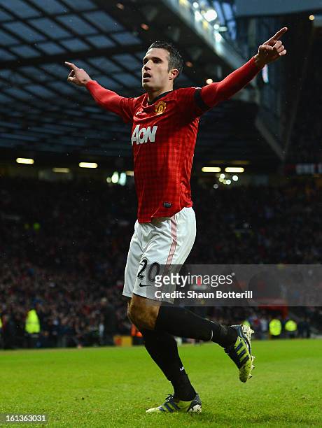 Robin van Persie of Manchester United celebrates scoring his team's second goal during the Barclays Premier League match between Manchester United...
