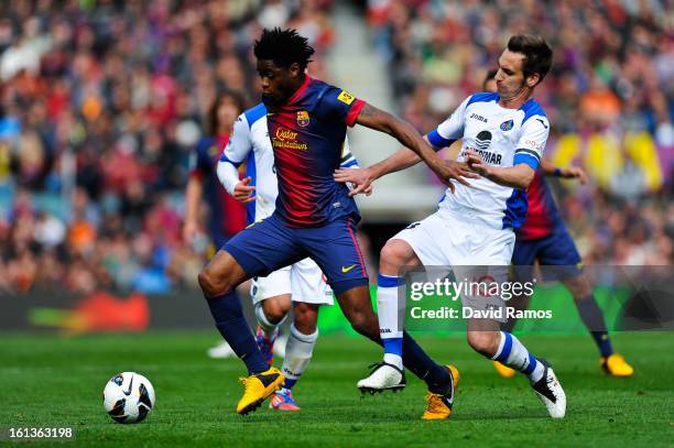 Alex Song of FC Barcelona duels for the ball with Borja Fernandez of Getafe CF during the La Liga match between FC Barcelona and Getafe CF at Camp...