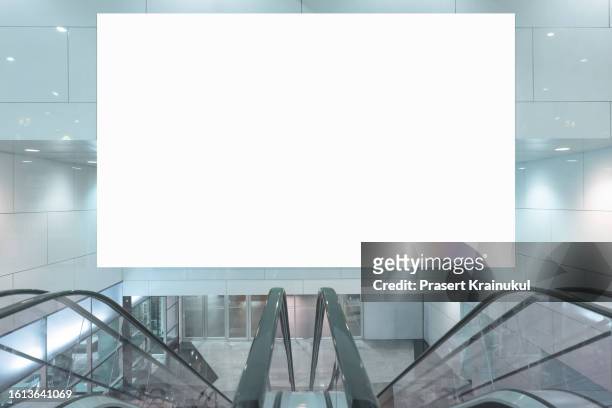 blank white banner at subway station. - shopping centre escalator stock pictures, royalty-free photos & images