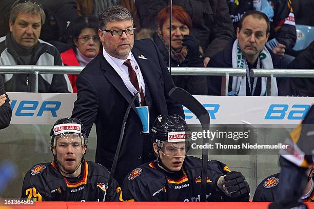 Pat Cortina, head coach of Germany looks on during the Olympic Icehockey Qualifier match between Germany and Austria on February 10, 2013 in...