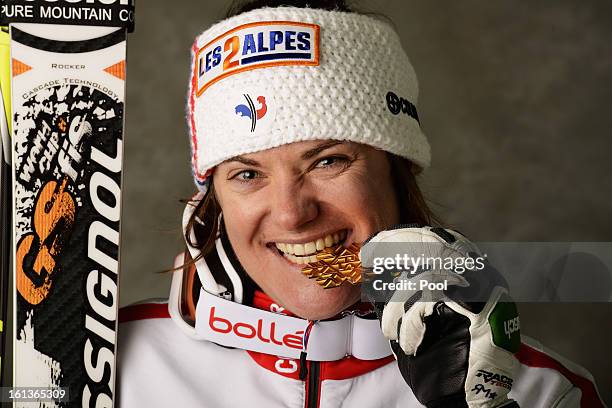 Marion Rolland of France celebrates with her gold medal after winning the Women's Downhill during the Alpine FIS Ski World Championships on February...