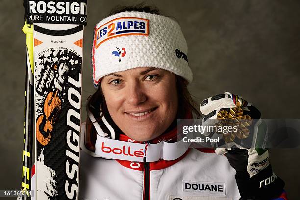 Marion Rolland of France celebrates with her gold medal after winning the Women's Downhill during the Alpine FIS Ski World Championships on February...