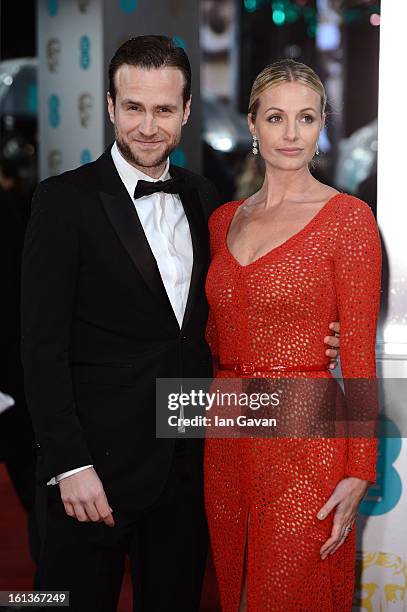 Rafe Spall and wife Elize Du Toit attend the EE British Academy Film Awards at The Royal Opera House on February 10, 2013 in London, England.