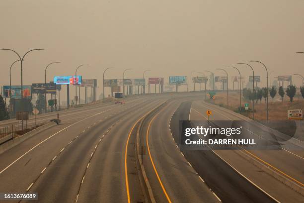 Empty highways are seen in West Kelowna, British Columbia, on August 20, 2023 as people are asked by authorities to stay off the roads as Creek fire...