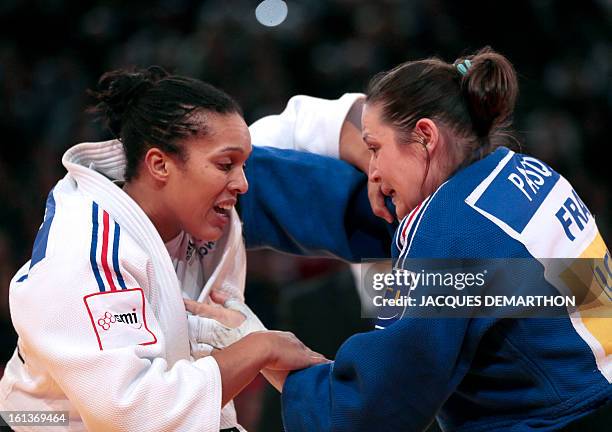 France's Lucie Decosse competes against France's Marie Pasquet on February 10, 2013 for the bronze medal of the Women -70kg category during the Paris...